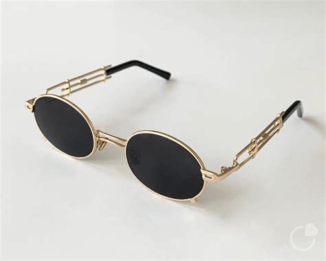 oval gold frame sunglasses|gold frame sunglasses men's.